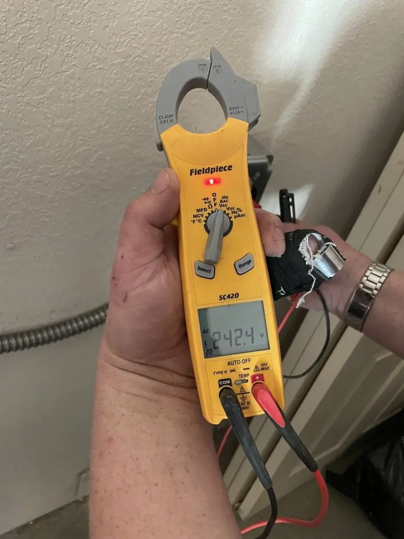 Voltage testing with clamp meter during Ceiling Fan Installation in Marple